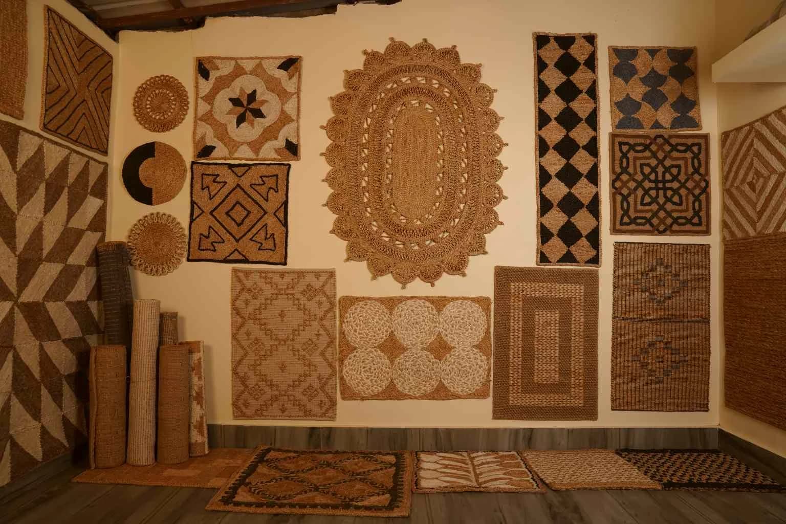 Assorted natural fibre rugs hanging and styled